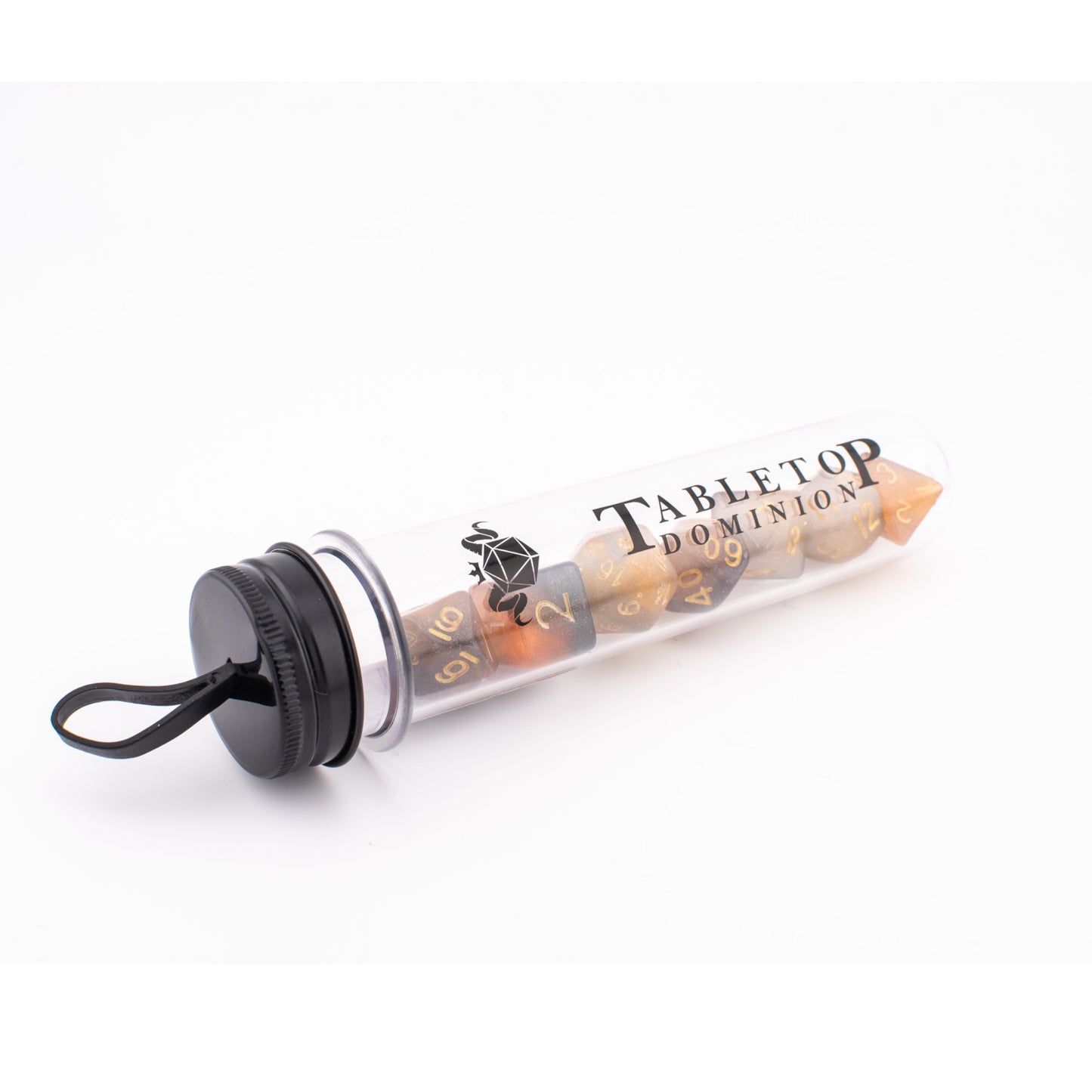 Clear Autumn acrylic dice displayed inside a Tabletop Dominion clear plastic tube, with all seven translucent orange‑grey dice visible through the packaging.