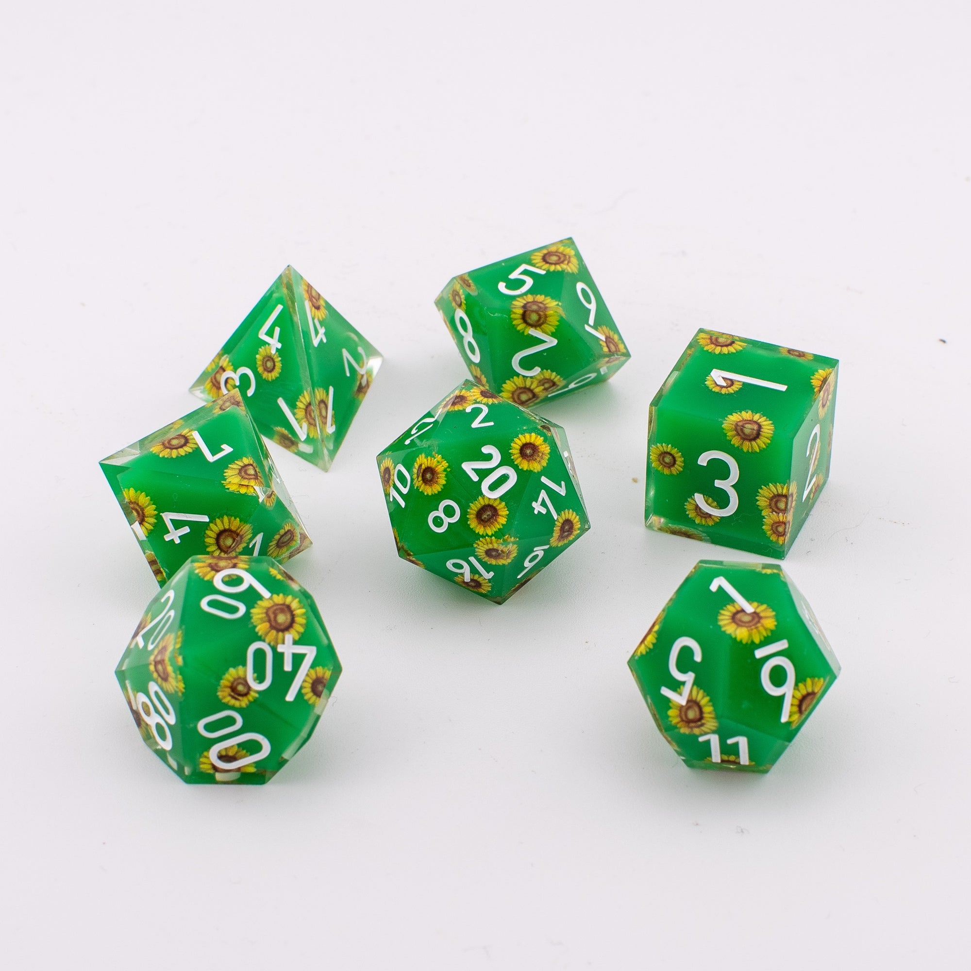 Unseen Strength sunflower art core resin dice set laid out on a table