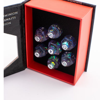 Tabletop Dominion Prismatic Elixir potion bottle dice set displayed in an open box with iridescent resin dice in foam.