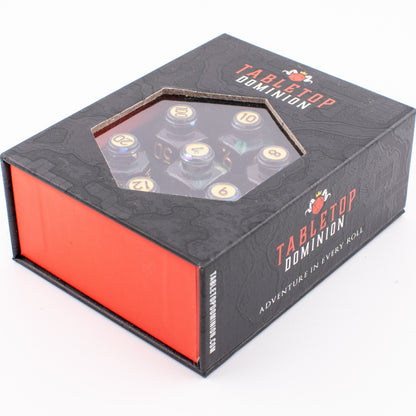 Tabletop Dominion Blood Alchemist potion bottle dice set in a closed display box with visible polyhedral dice.