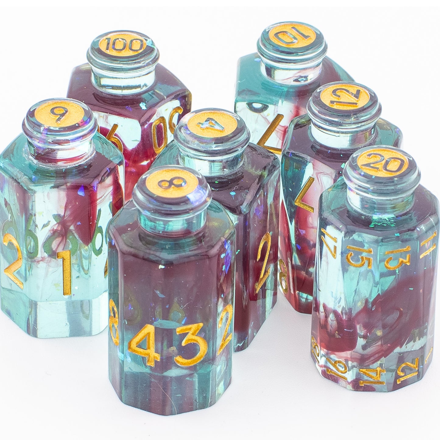 Tabletop Dominion Blood Alchemist potion bottle dice arranged together on a white background with blue‑red resin and gold numbering.