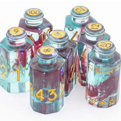 Tabletop Dominion Blood Alchemist potion bottle dice arranged together on a white background with blue‑red resin and gold numbering.