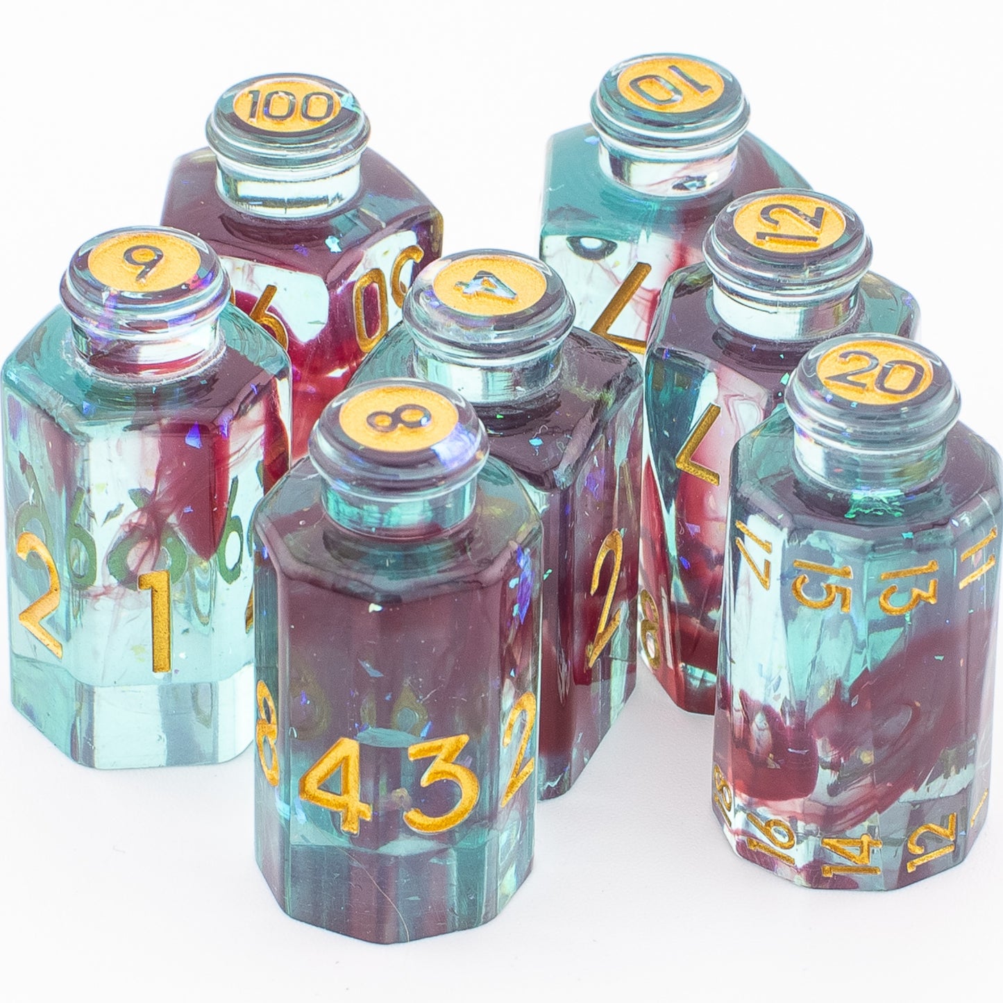 Tabletop Dominion Blood Alchemist potion bottle dice arranged together on a white background with blue‑red resin and gold numbering