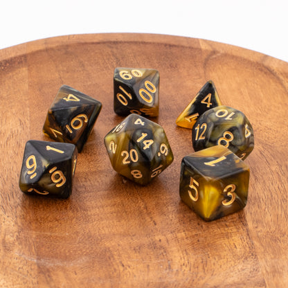 Venomous Sting acrylic dice scattered across a wooden tabletop.