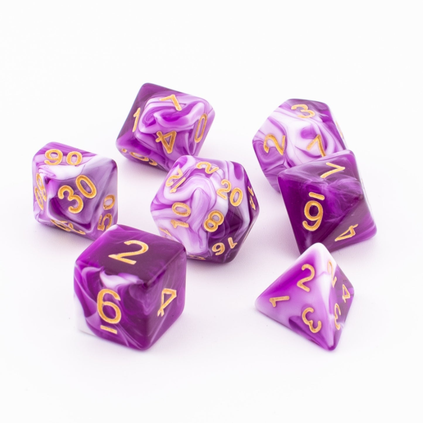 Pink, purple, and white Celestial Whisper dice arranged on a white background.