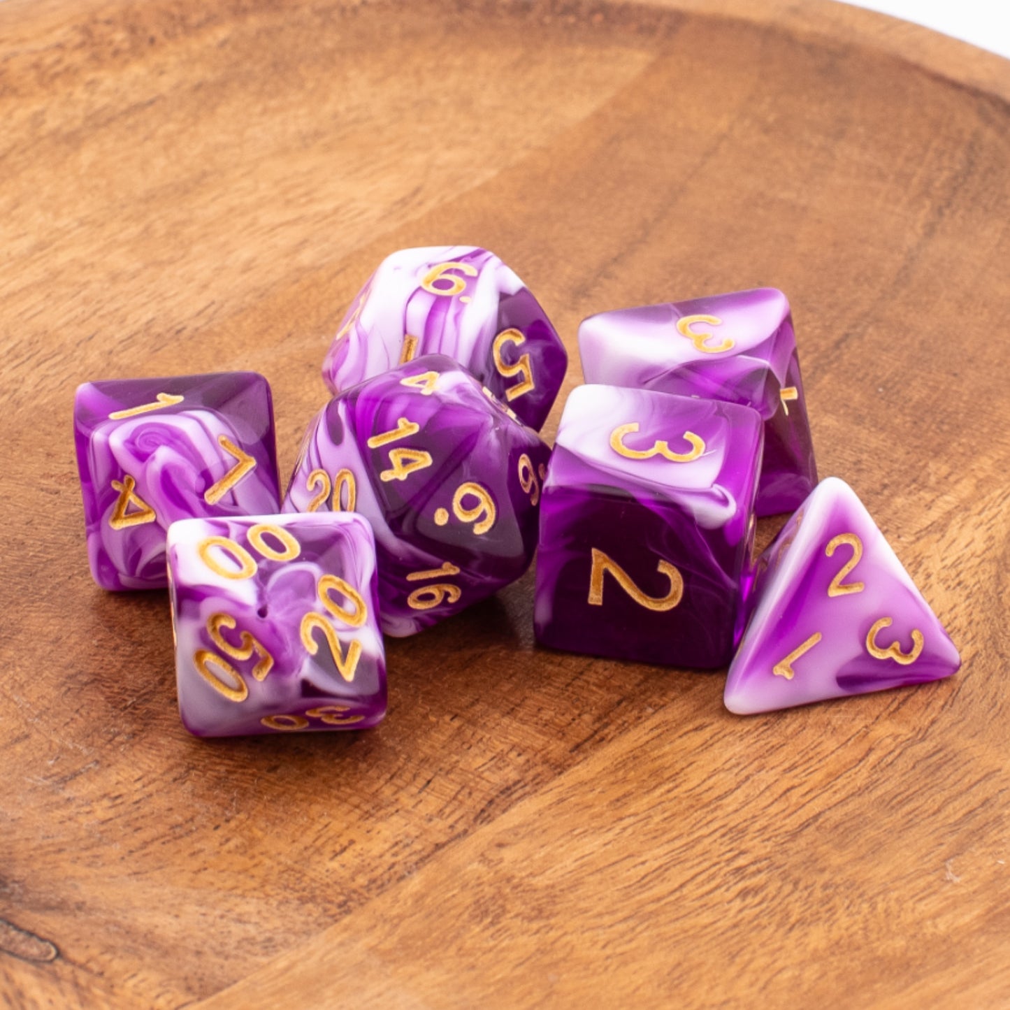 Celestial Whisper dice neatly arranged on a wooden surface.