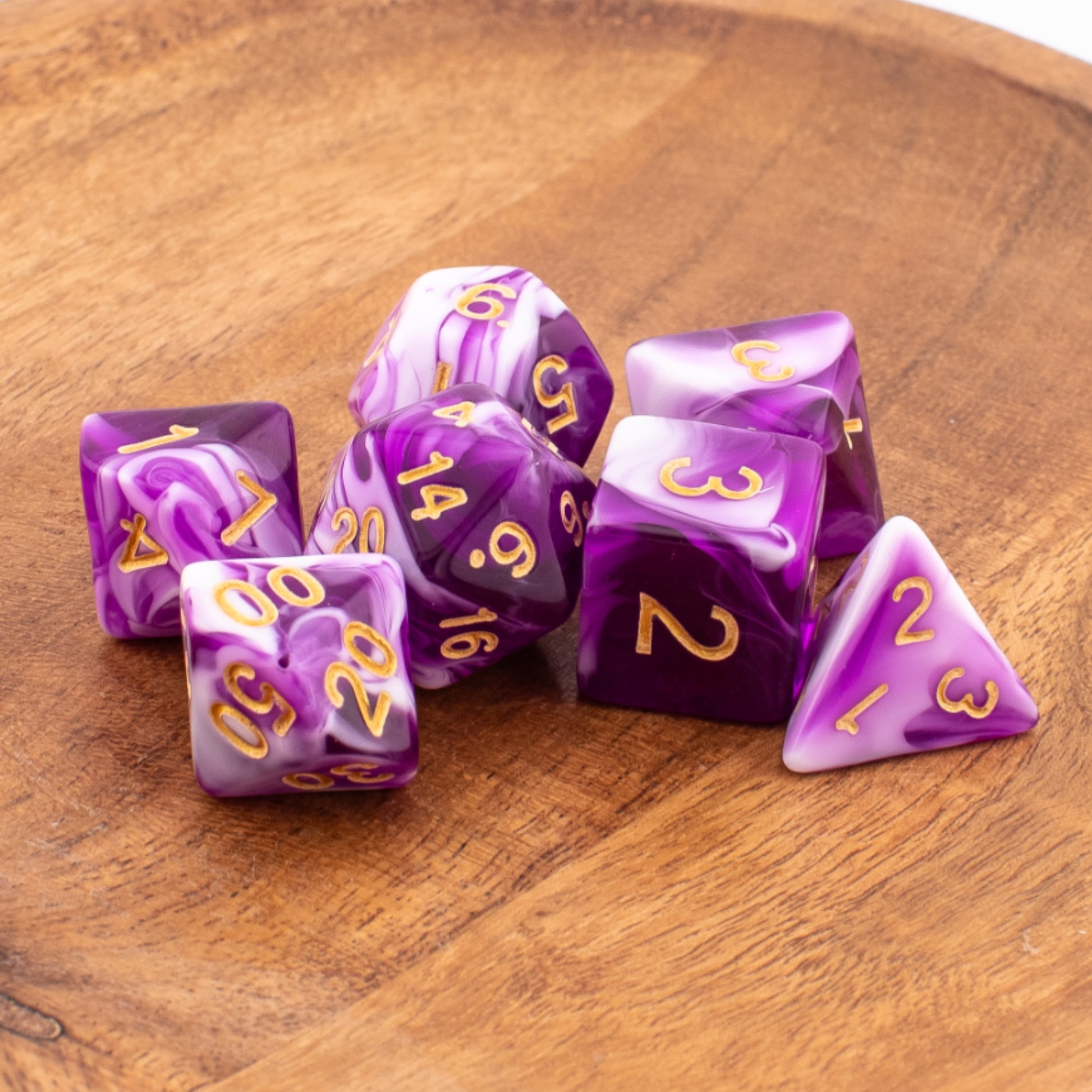 Celestial Whisper dice neatly arranged on a wooden surface.