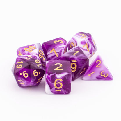 Clustered Celestial Whisper dice with pink, purple, and white swirls and gold numbers.