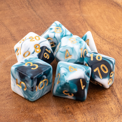 Whispering Depths acrylic dice arranged neatly on a wooden surface.