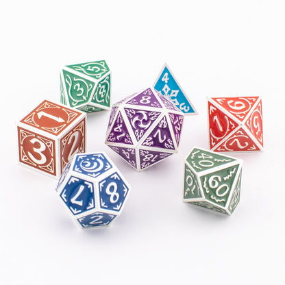 Tabletop Dominion Prismatic Elemental metal dice spread out on a white background, showing multicoloured engraved designs across all seven polyhedral shapes.