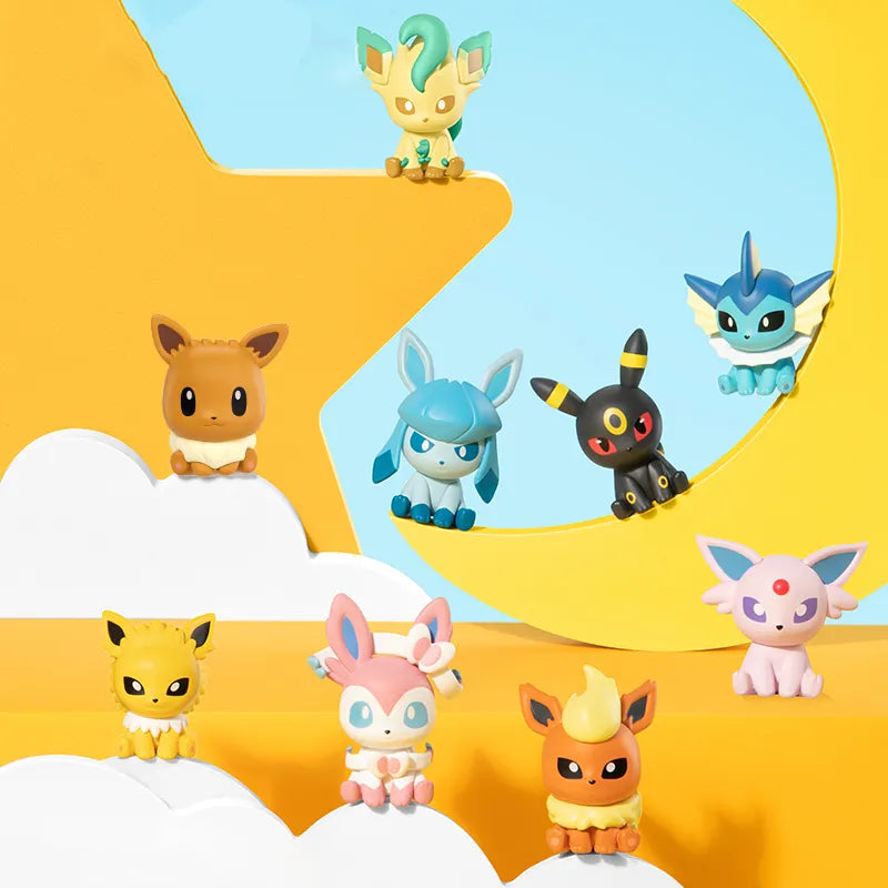 Cute Eeveelutions display featuring Eevee, Vaporeon, Jolteon, Flareon, Espeon, Umbreon, Leafeon, Glaceon, and Sylveon arranged on a colourful star‑and‑moon themed background.